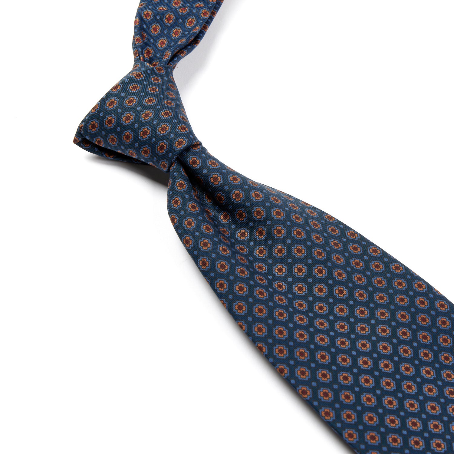 A Sovereign Grade Blue Small Floral Ancient Madder Tie, handmade in the United Kingdom and sold by KirbyAllison.com.
