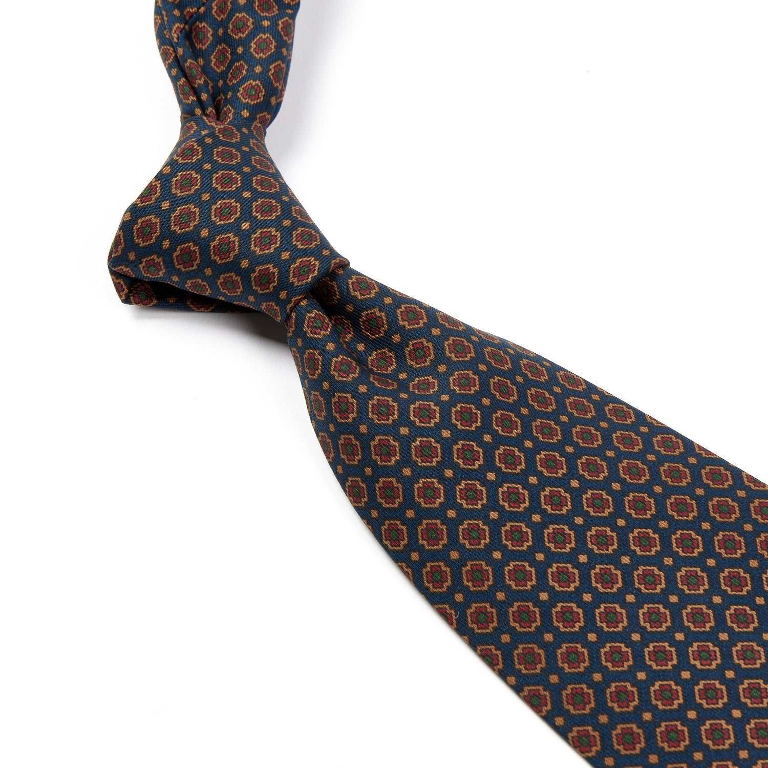 A Sovereign Grade Dark Navy Small Floral Ancient Madder Tie with an orange and brown pattern, handmade in the United Kingdom by KirbyAllison.com.