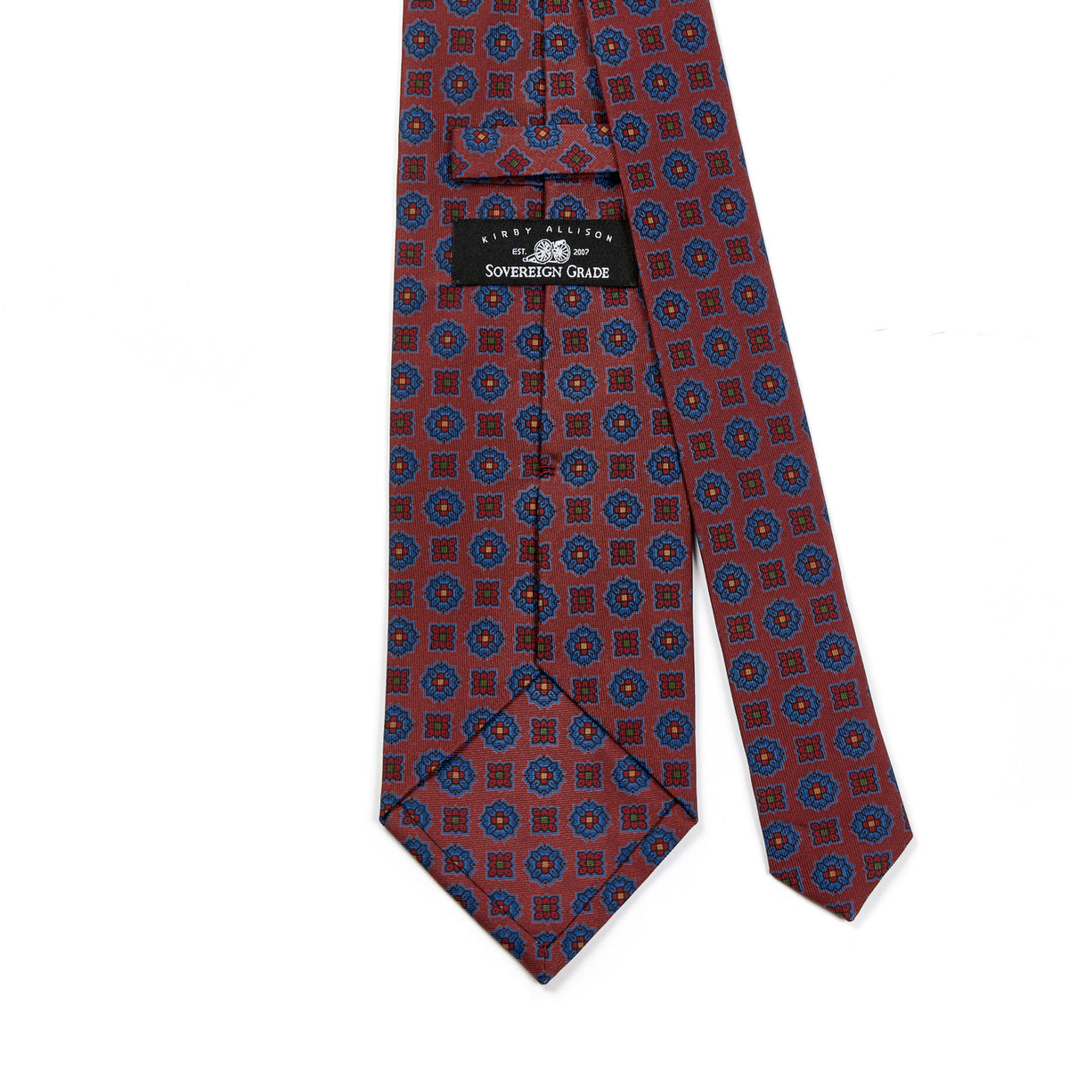 A Sovereign Grade Rust Floral Diamond Ancient Madder Tie, 150x8.5 cm by KirbyAllison.com with a red and blue pattern.