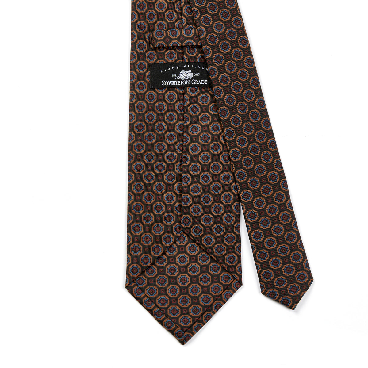 A KirbyAllison.com Sovereign Grade Brown/Tan Floral Medallion Ancient Madder Tie with circles on it.
