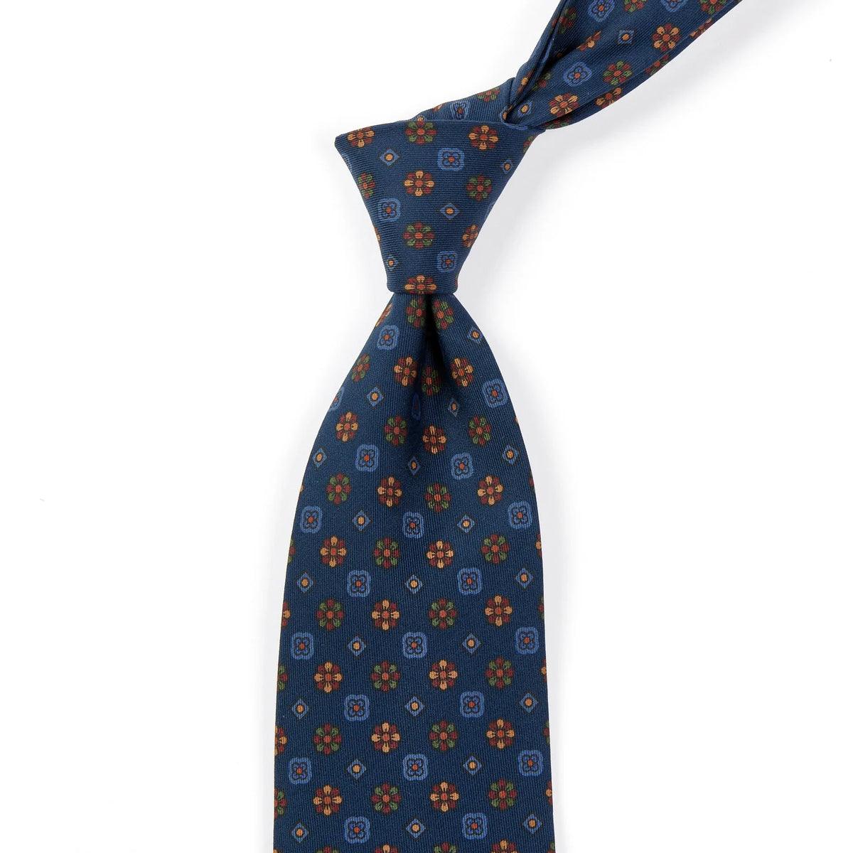 A Sovereign Grade Dark Navy Mixed Floret Ancient Madder Tie by KirbyAllison.com with blue and orange designs of the highest quality.