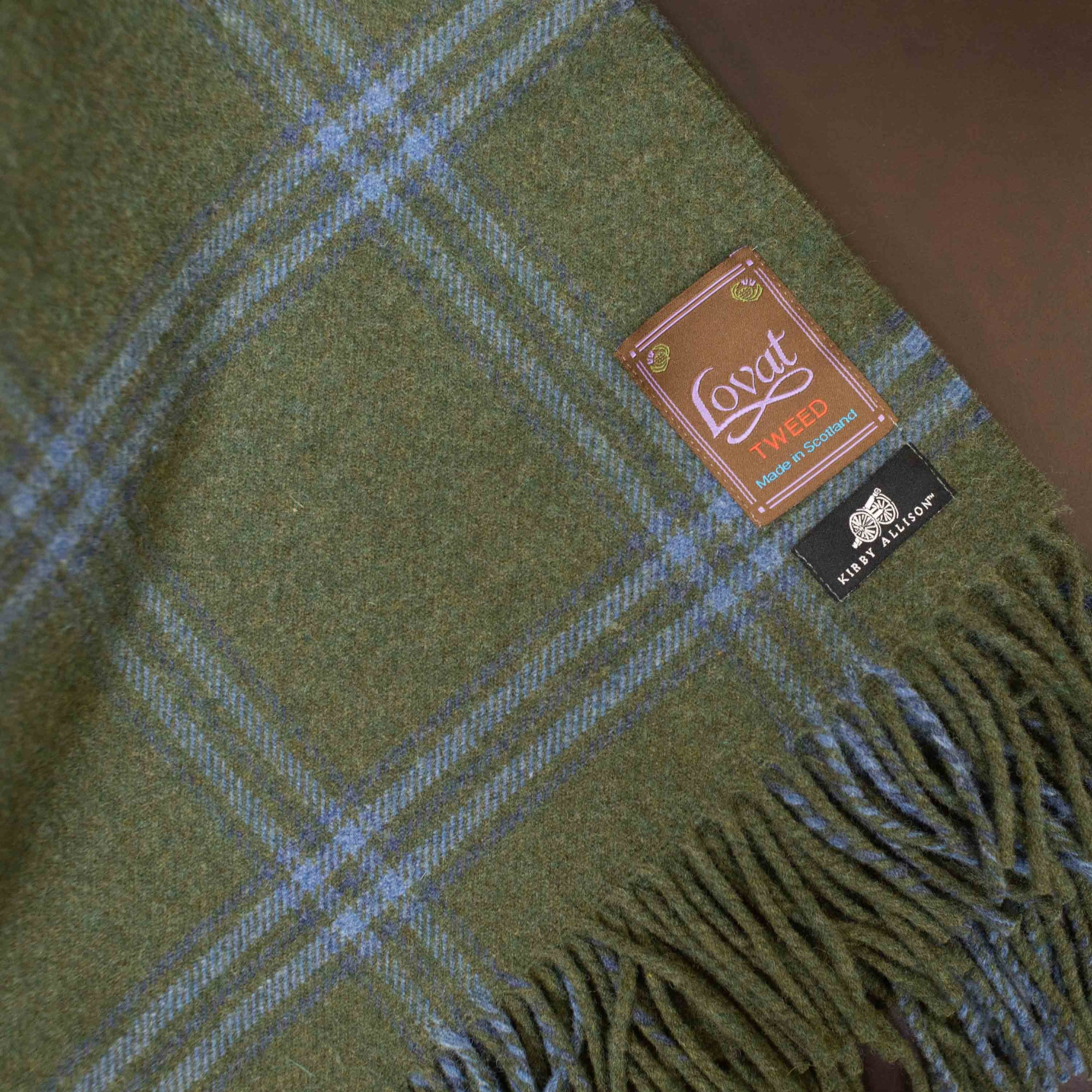 A new Kirby Allison Lovat Mill Suit to Shoot Tweed Wool Throw blanket in green and blue plaid.