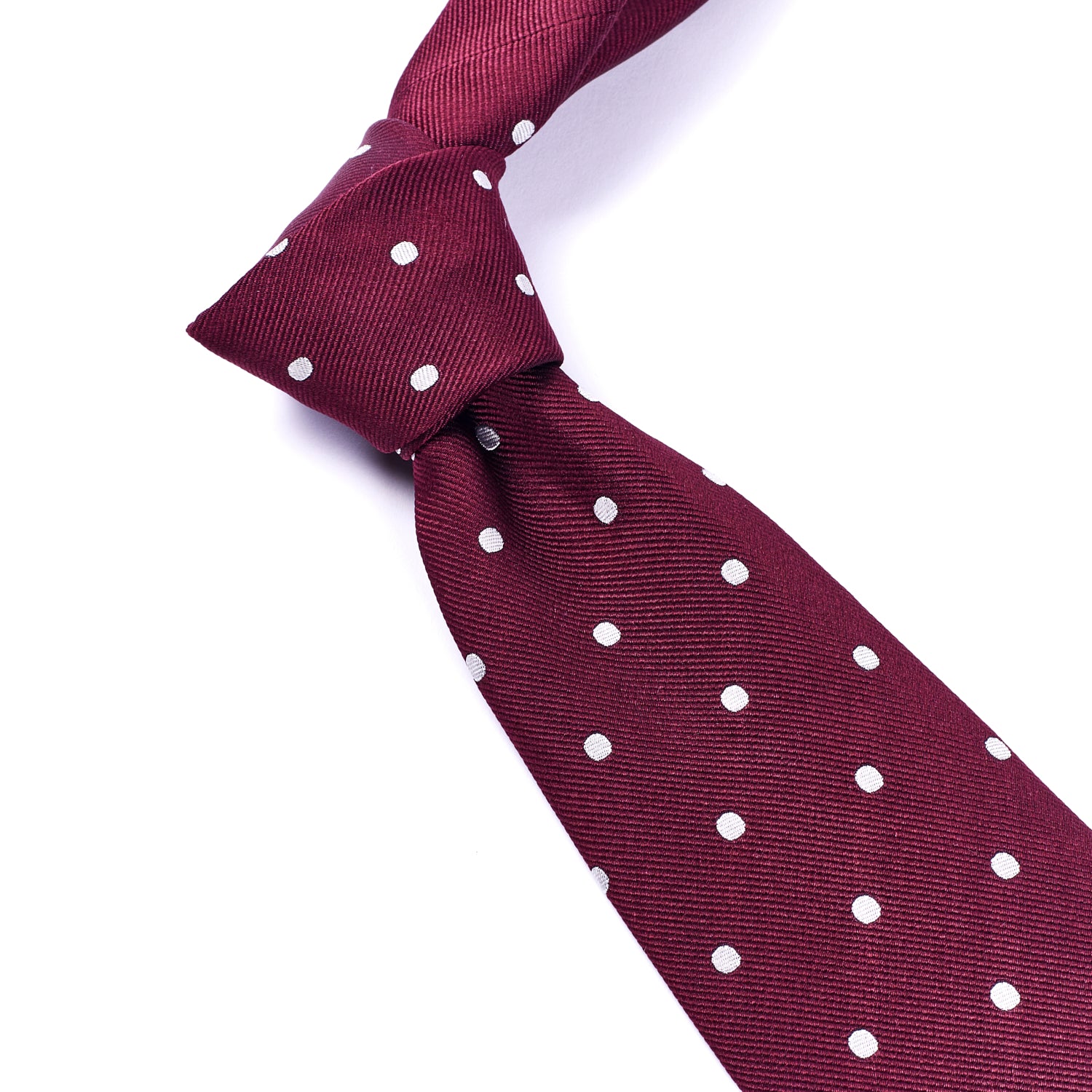 A Sovereign Grade Woven Oxblood Wide Dot Tie on a white background from KirbyAllison.com.