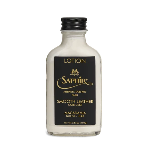 A bottle of Saphir Medaille d'Or Macadamia Conditioning Lotion by Soletech on a black background.