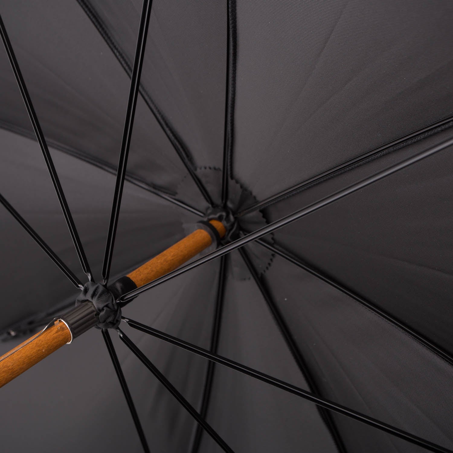 A Black Doorman Umbrella with Chestnut Handle providing rain protection with a black canopy, manufactured by KirbyAllison.com.