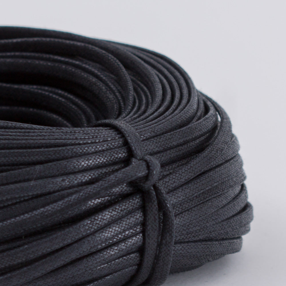 A replacement spool of Wellington Flat Waxed Dress Shoelaces by KirbyAllison.com for dress shoes.