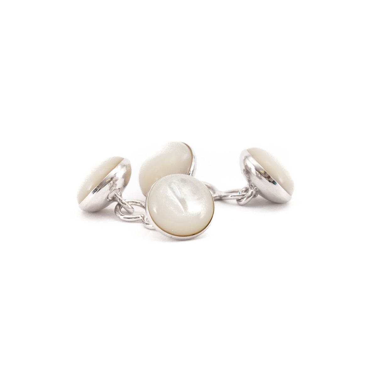 Three Mother of Pearl Silver Stone Capsule Cufflinks on a silver plate by KirbyAllison.com.
