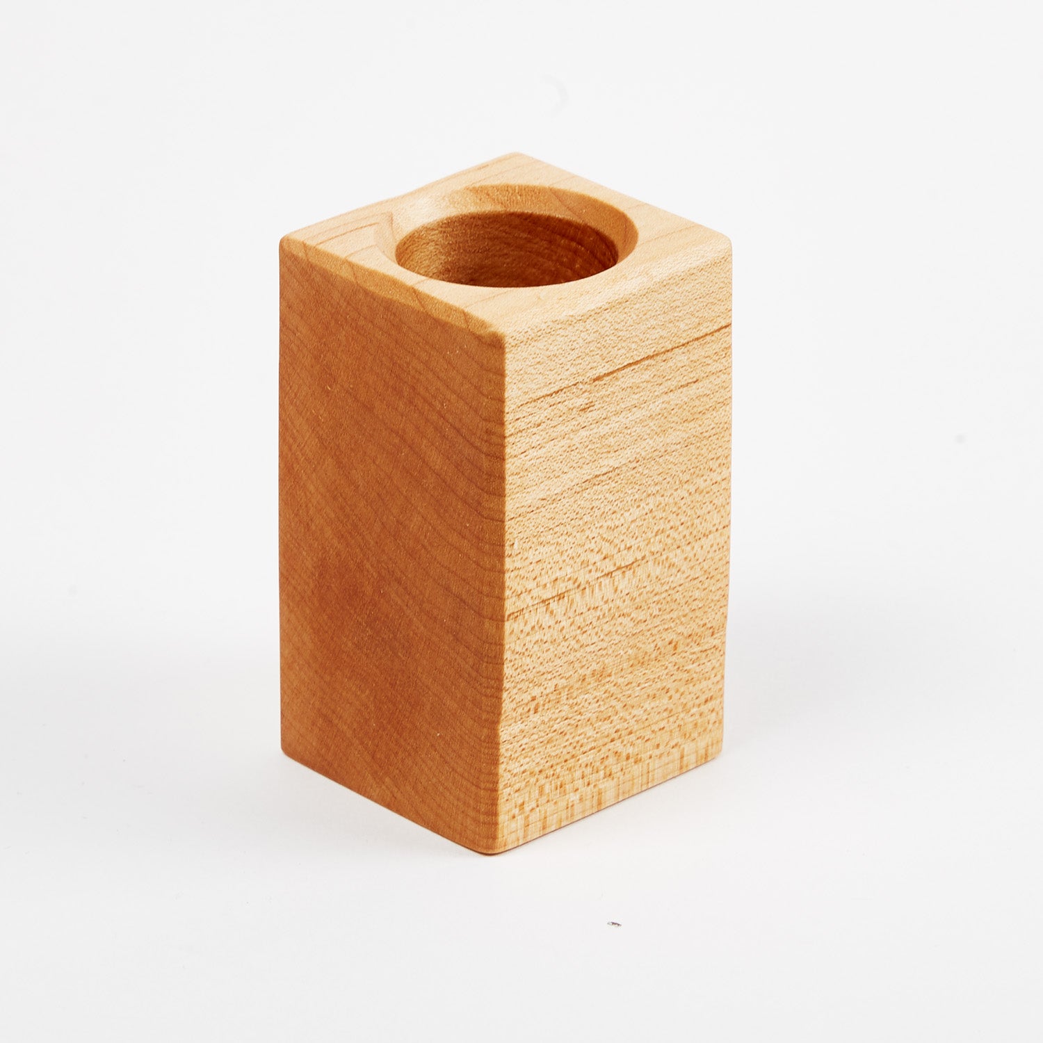 A KirbyAllison.com Small Wooden Cube on a white background.