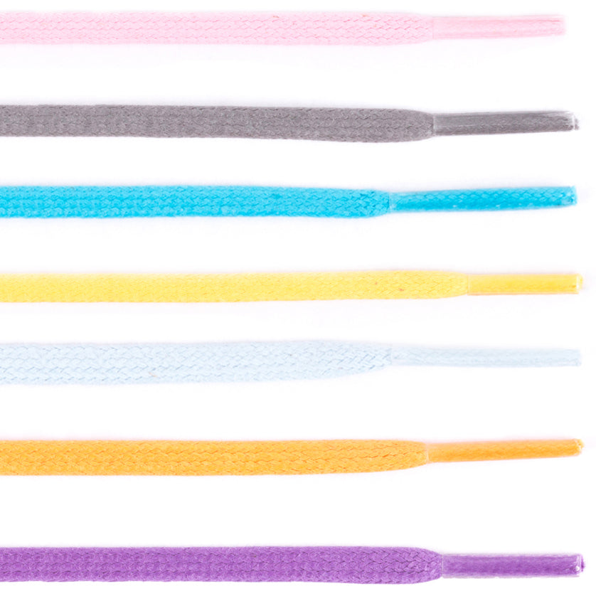 Multiple colors of Colored Flat Waxed Shoelaces on a white background at KirbyAllison.com.