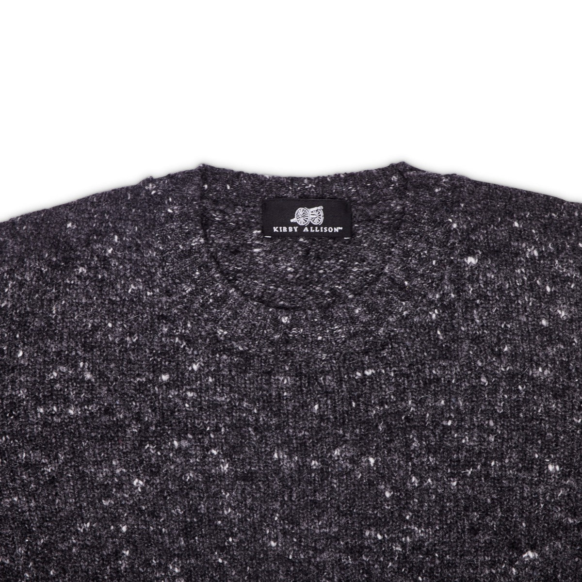 A Sovereign Grade Grey Donegal Crew Neck Sweater from KirbyAllison.com with white speckles on it.