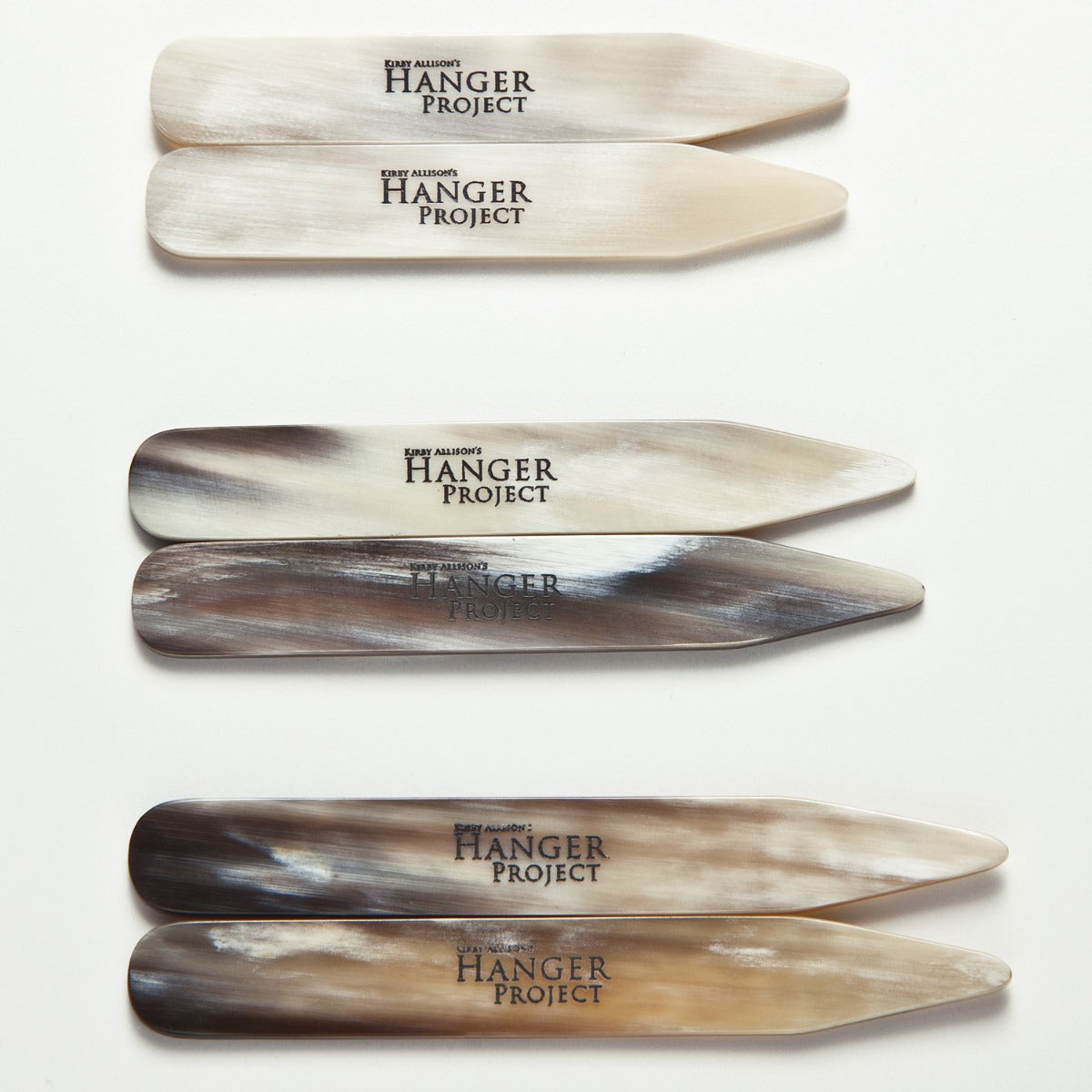 A set of Kirby Allison Horn Collar Stays on a white surface from KirbyAllison.com.