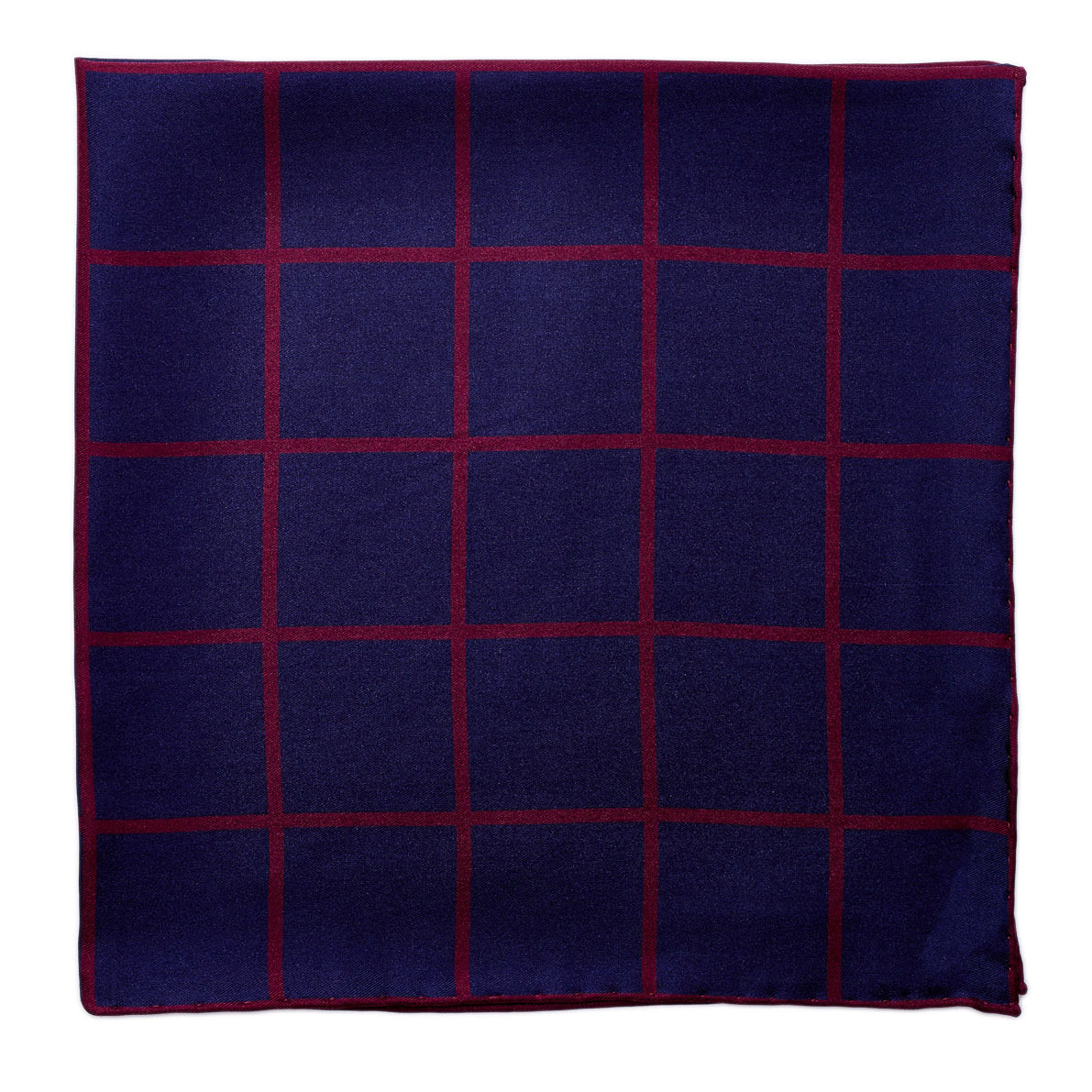 A Sovereign Grade Prince of Wales pocket square in navy and burgundy plaid with silk fabric, available at KirbyAllison.com.