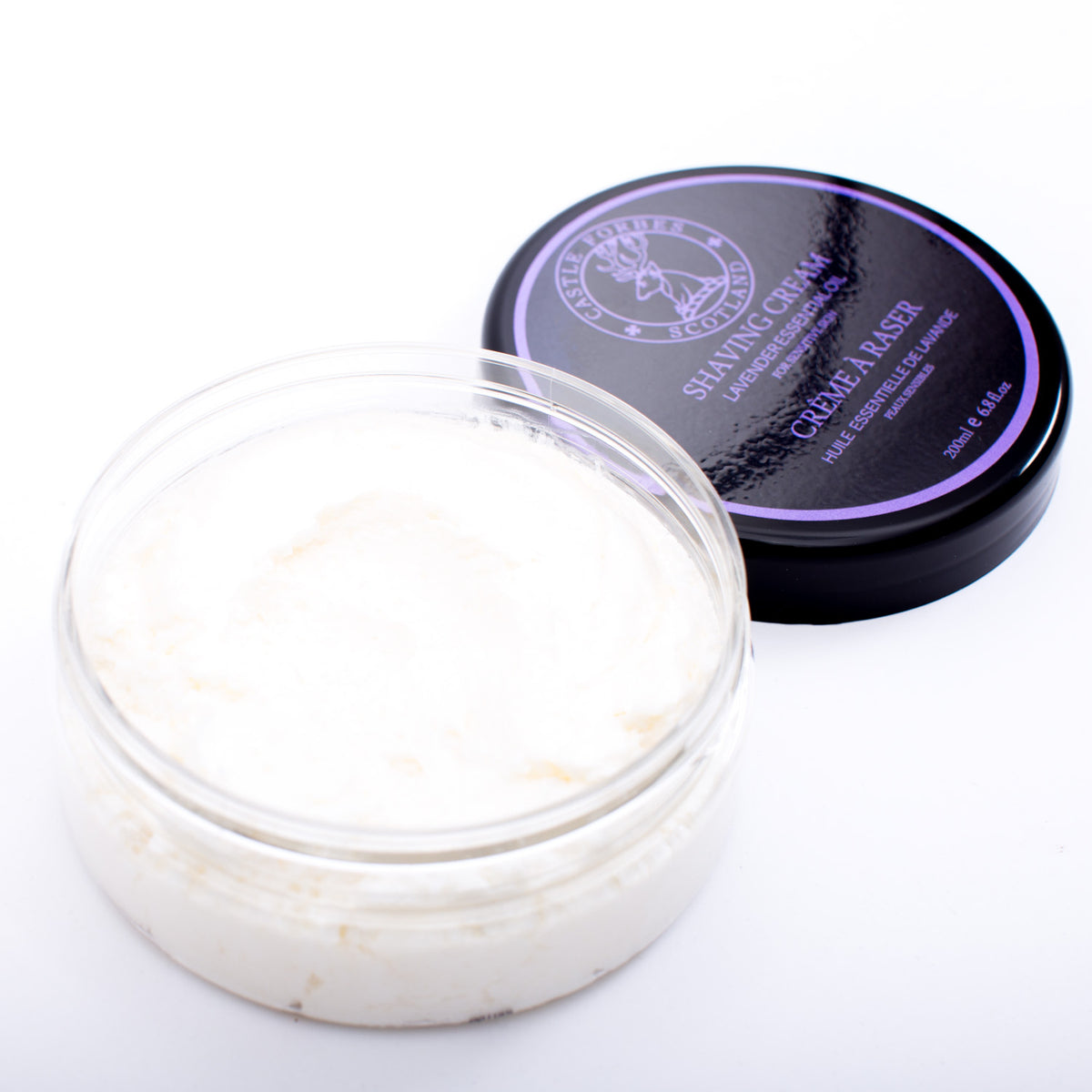 A luxurious jar of Castle Forbes Lavender Essential Oil Shaving Cream with a purple lid from KirbyAllison.com.