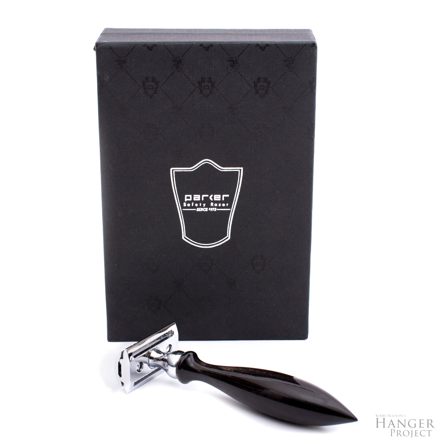 A black Parker 3-Piece Horn Safety Razor from KirbyAllison.com with a black box in front.