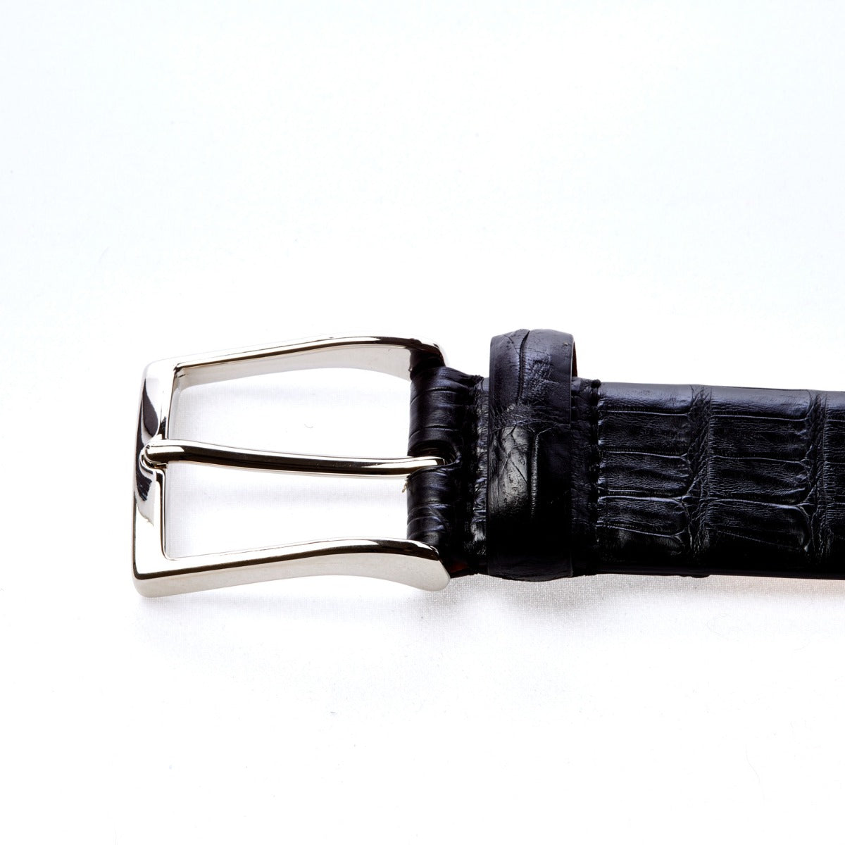 A Sovereign Grade Black Crocodile Belt with a crocodile skin texture, handcrafted in Italy by KirbyAllison.com.