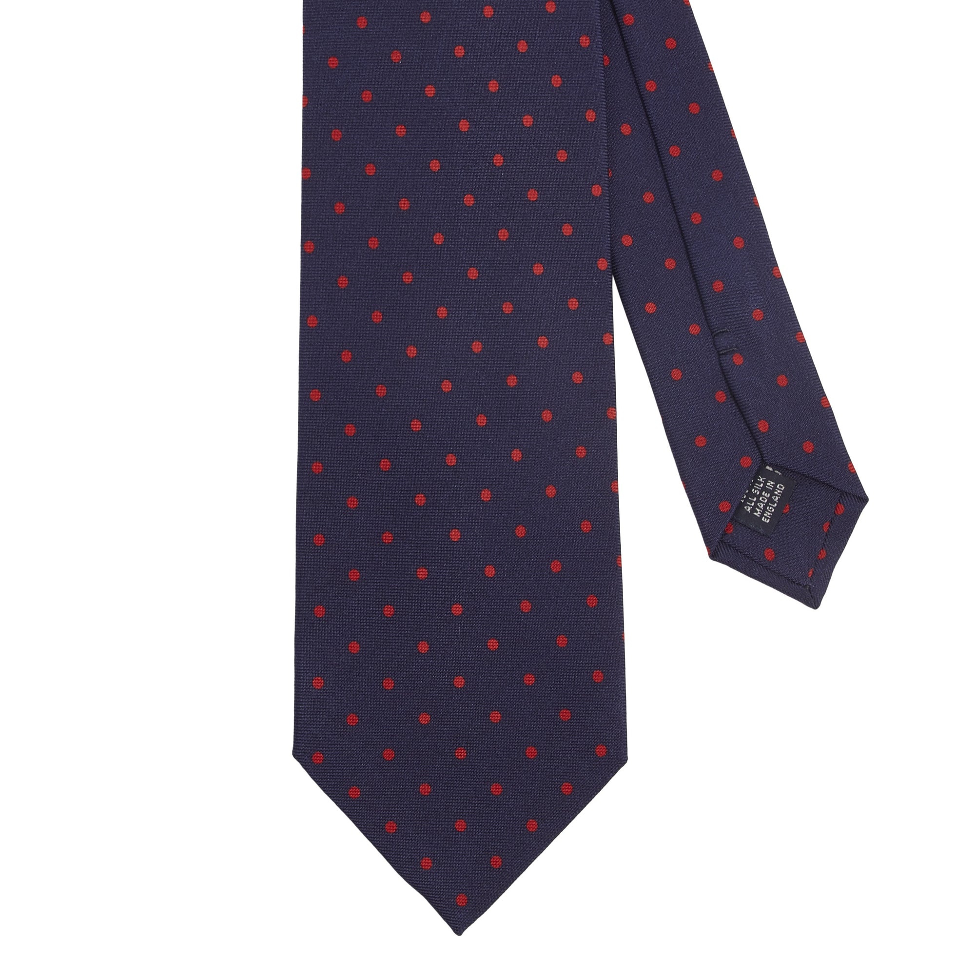 A handmade Sovereign Grade Navy-Red London Dot Printed Silk Tie by KirbyAllison.com with red and blue polka dots.