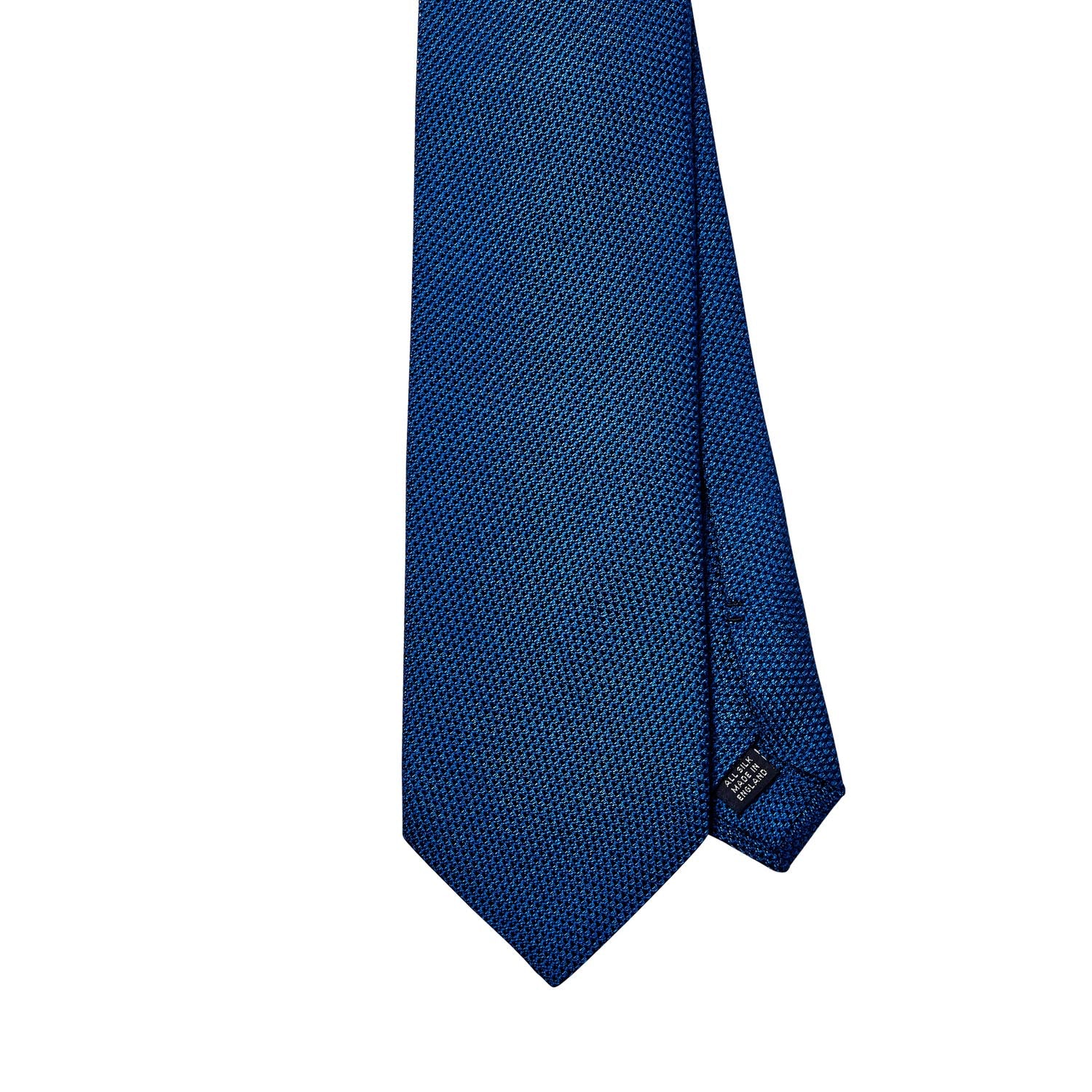 Handmade KirbyAllison.com Sovereign Grade Grenadine Fina Bright Blue Tie in the United Kingdom, featuring a blue tie on a white background.