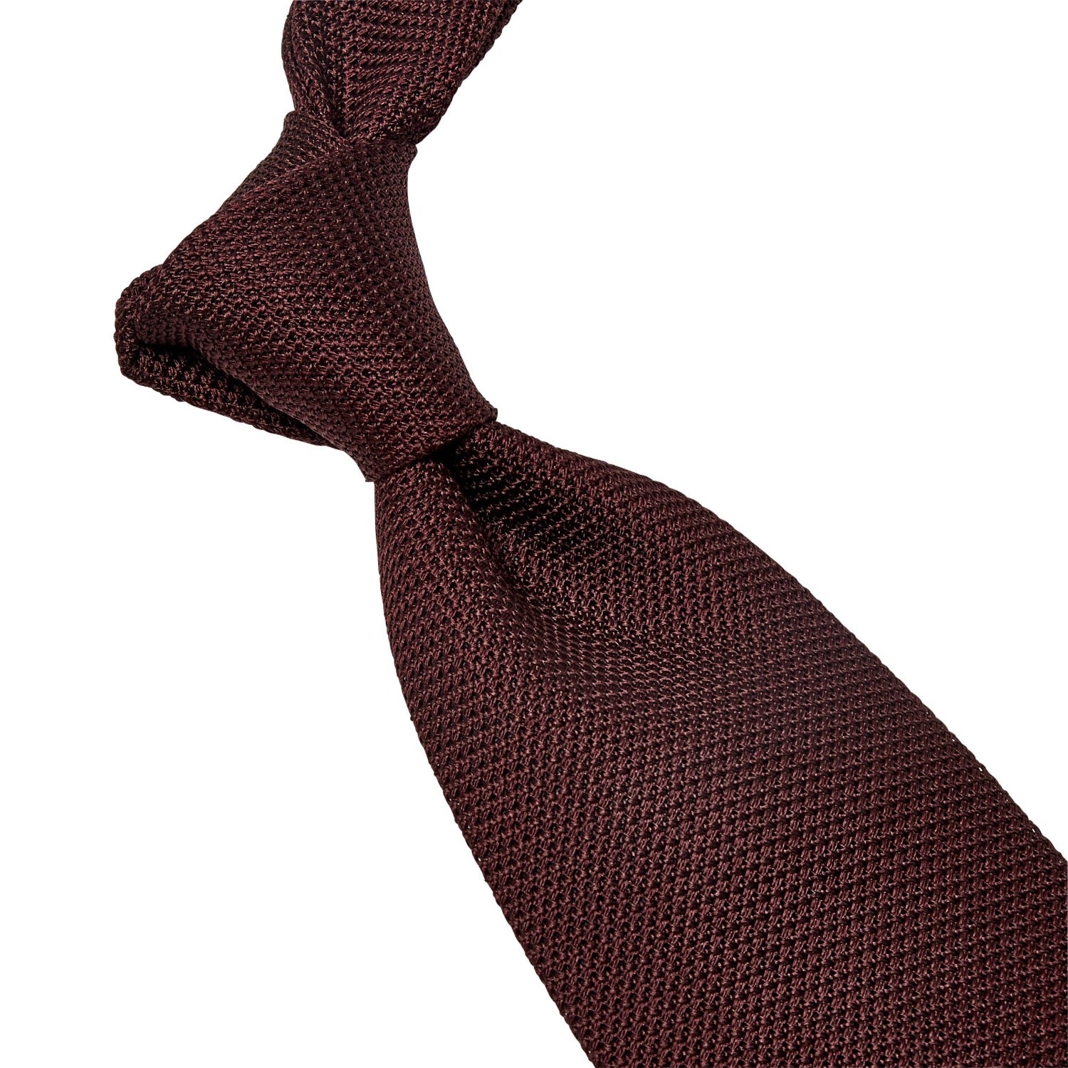 A handmade Sovereign Grade Grenadine Fina Burgundy Tie from the United Kingdom on a white background, featuring KirbyAllison.com ties.