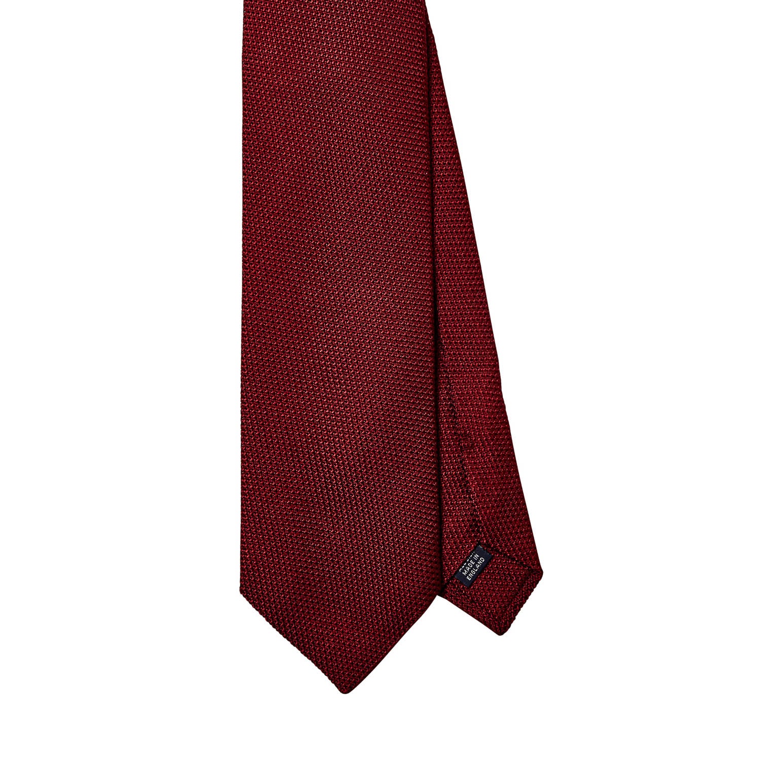 A Sovereign Grade Grenadine Fina Ruby Tie handmade by KirbyAllison.com in the United Kingdom on a white background.