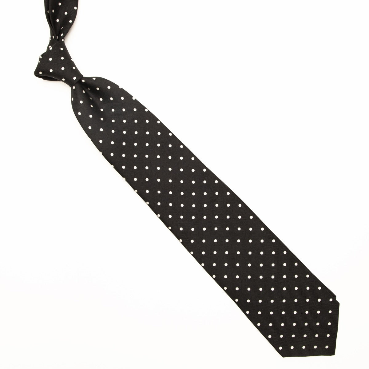 A handmade Sovereign Grade Black/White 36oz London Dot tie from KirbyAllison.com on a white background.