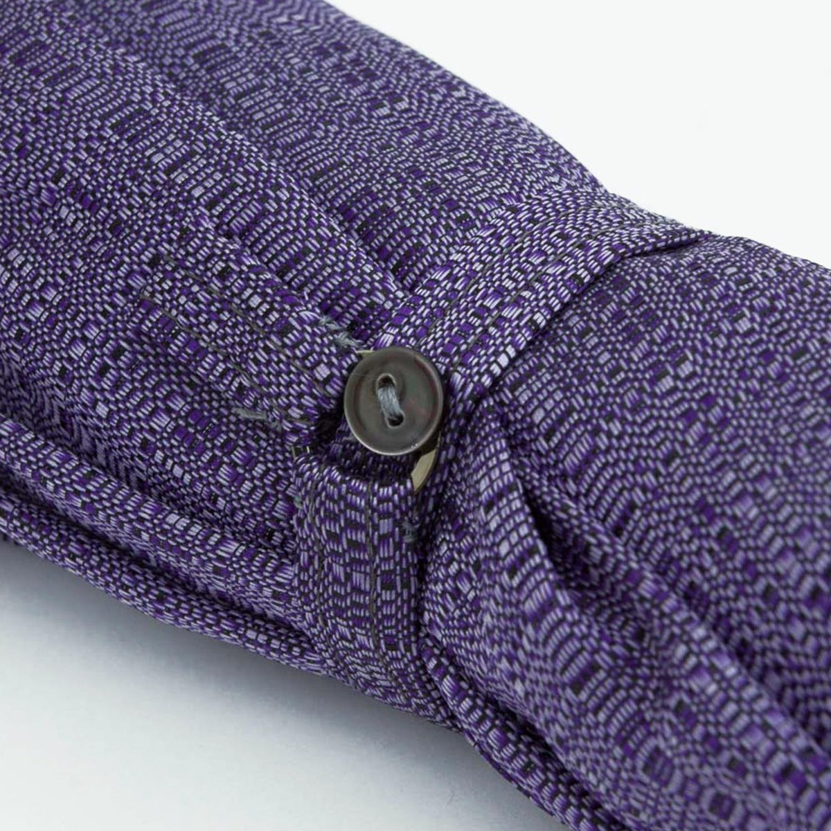 A close up of a KirbyAllison.com Imperial Purple Travel Umbrella with Maple Handle and an Italian umbrella.