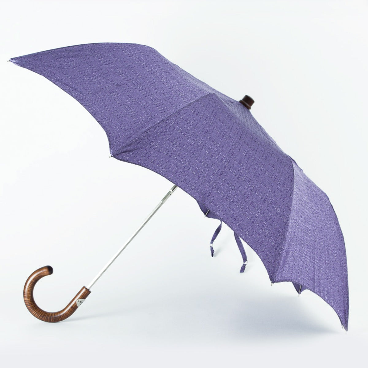 An Imperial Purple Travel Umbrella with Maple Handle from KirbyAllison.com on a white background.