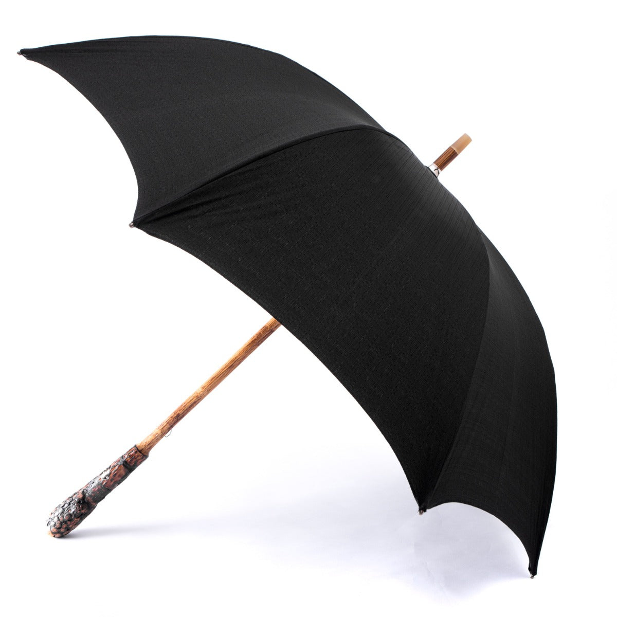 A Manila Root Solid Stick umbrella with an Imperial Black poly-cotton canopy by KirbyAllison.com.