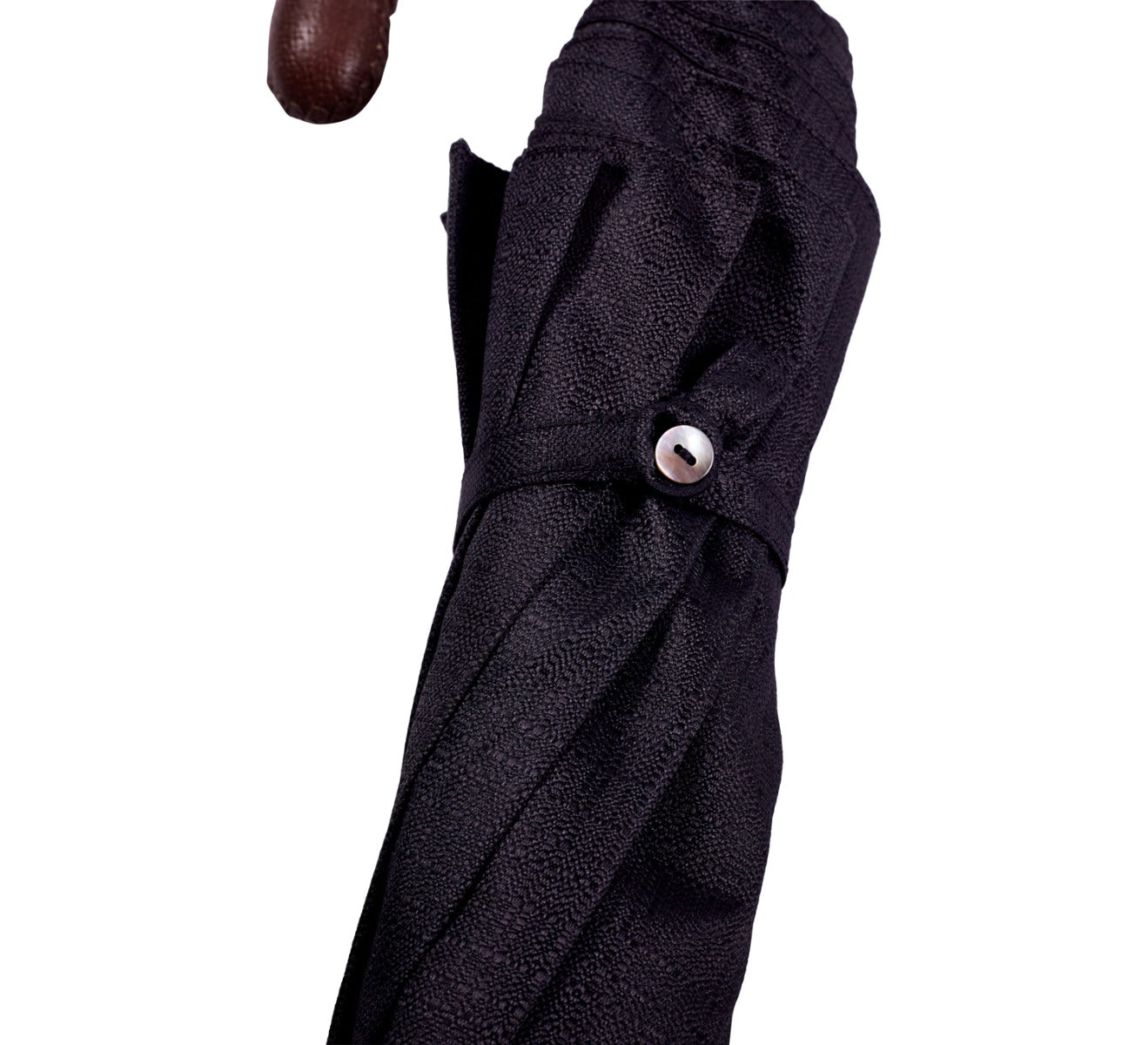 A KirbyAllison.com Brown Pigskin Travel Umbrella with Black Canopy and a black handle.