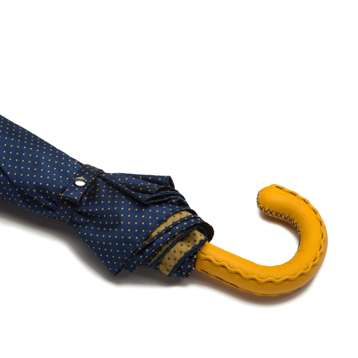 A Navy Yellow-Dot Travel umbrella with a yellow leather handle from KirbyAllison.com.