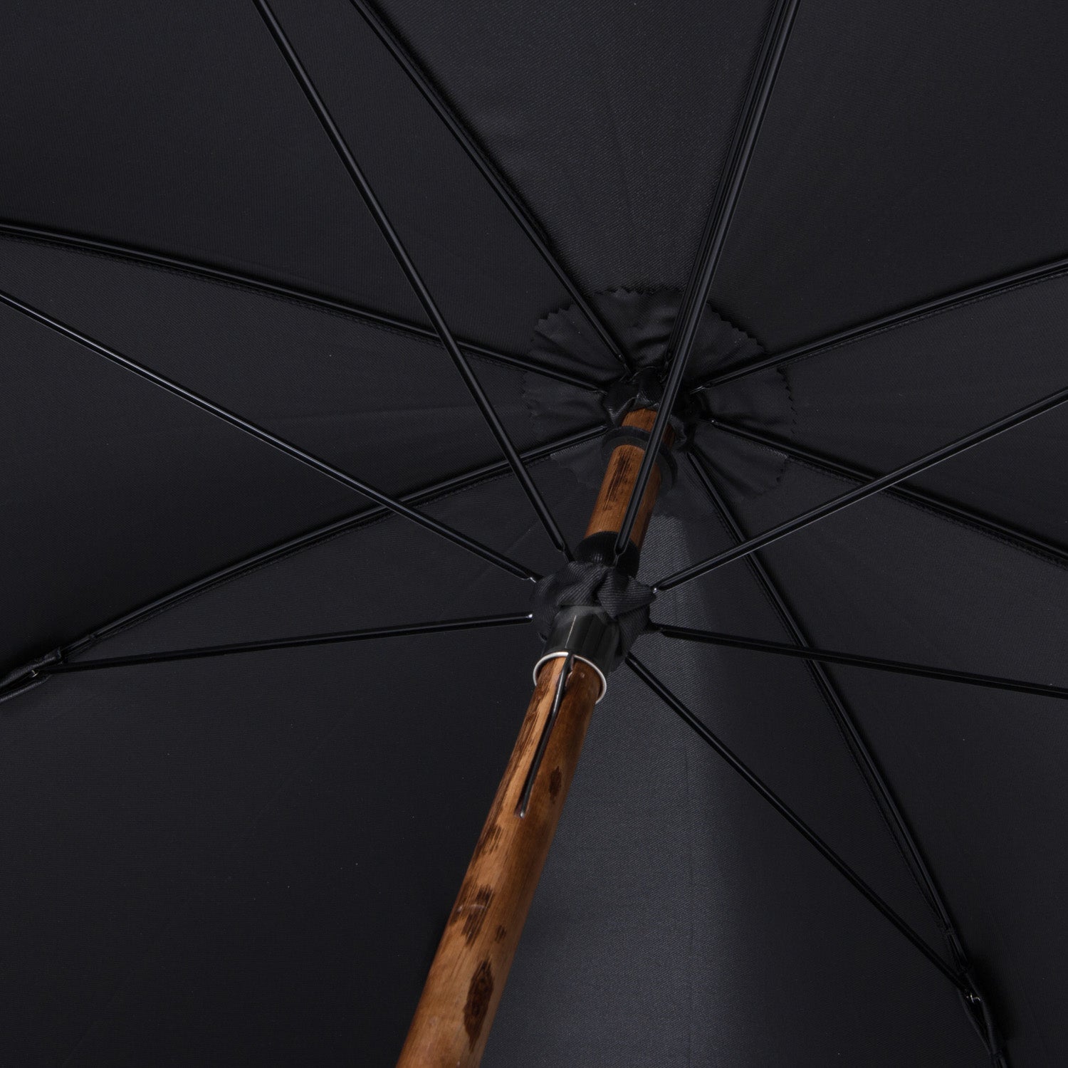 A Walnut Solid-Stick Umbrella with Black Canopy from KirbyAllison.com.