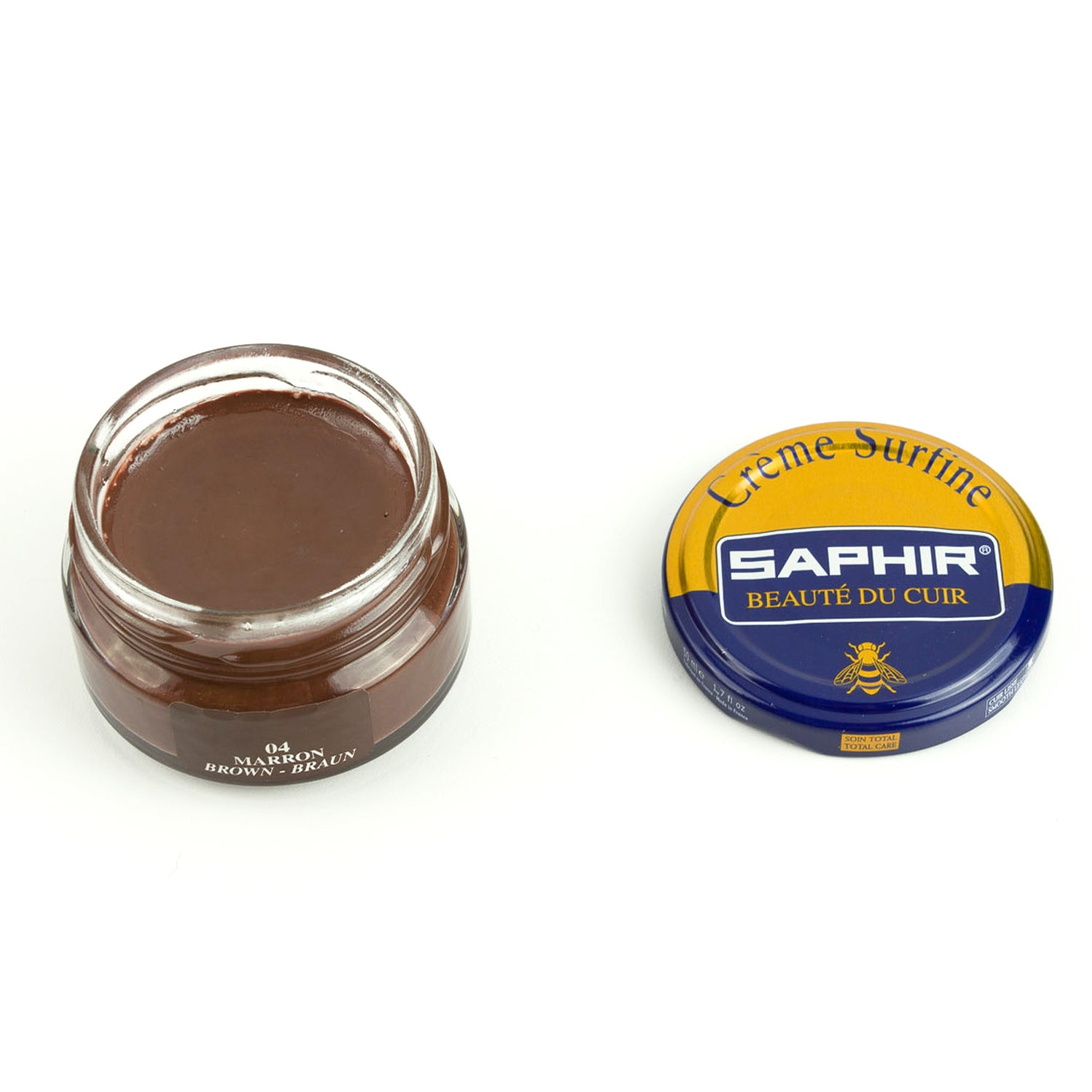 A tin of Saphir Beaute de Cuir Cream Polish by KirbyAllison.com next to a tin.