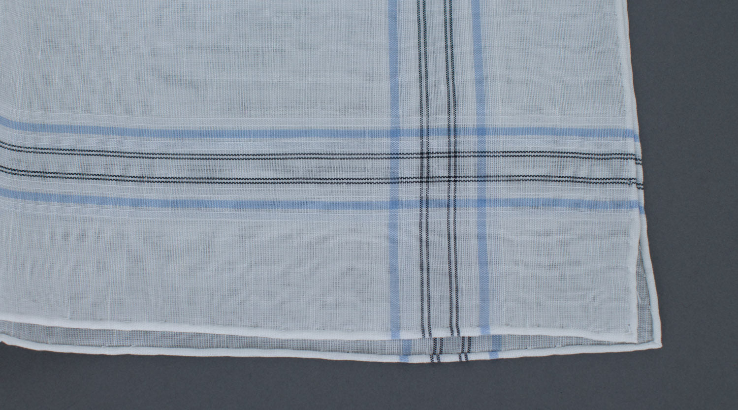 A Simonnot Godard Aran Pocket Square with blue and white stripes, made in France, available at KirbyAllison.com.