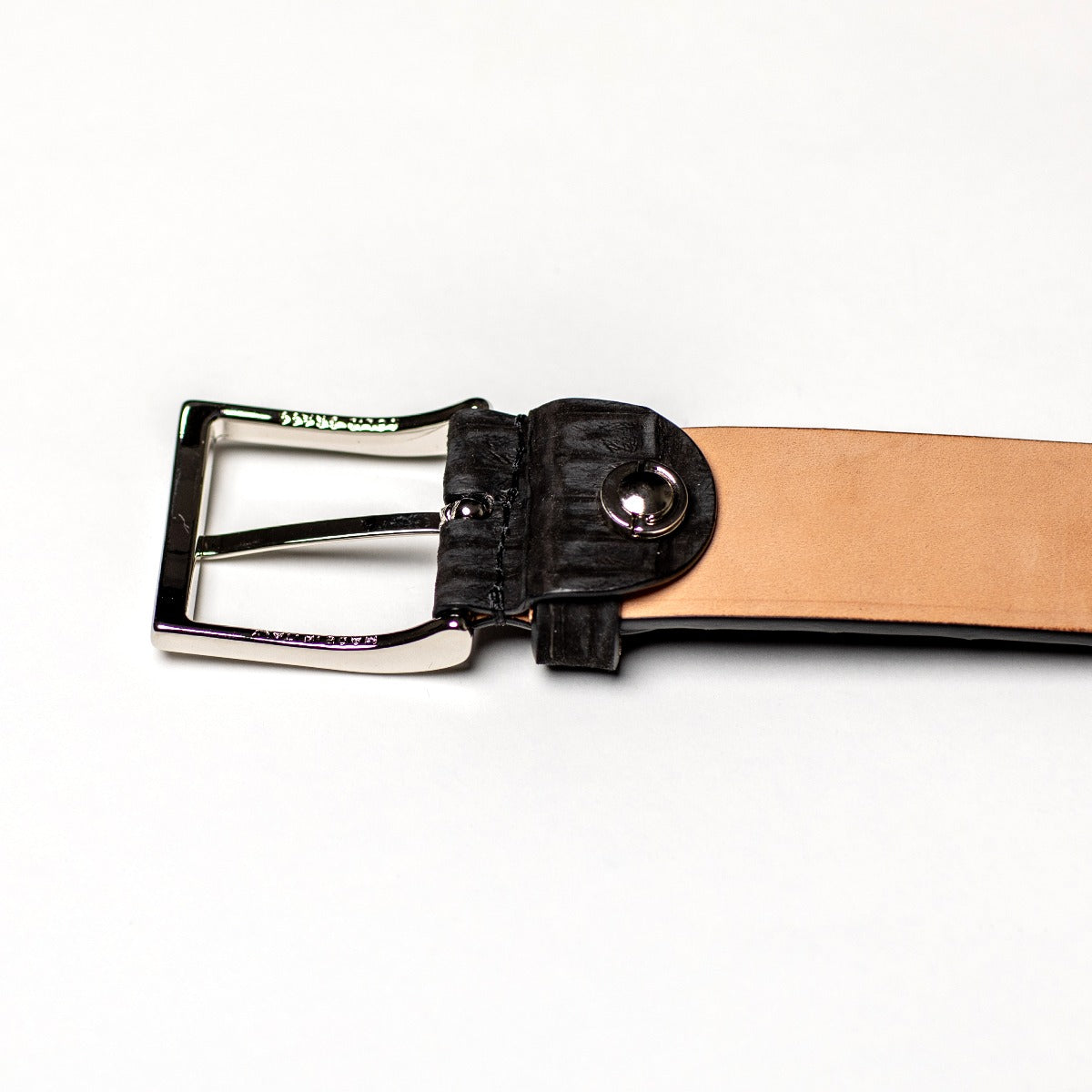 A Simonnot Godard Black Nubuck Crocodile Belt with a silver buckle featuring a nubuck texture by KirbyAllison.com.