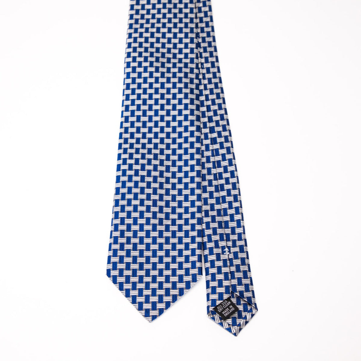 A Sovereign Grade Blue Basket Weave Silk tie from KirbyAllison.com, featuring a cobalt blue and white checkered pattern on a white background.