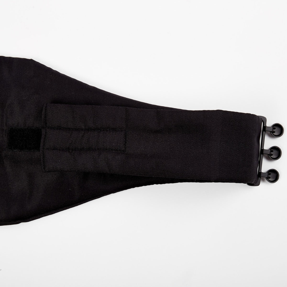 A formalwear accessory: A Sovereign Grade Black Barathea Cummerbund by KirbyAllison.com with a buckle on it.