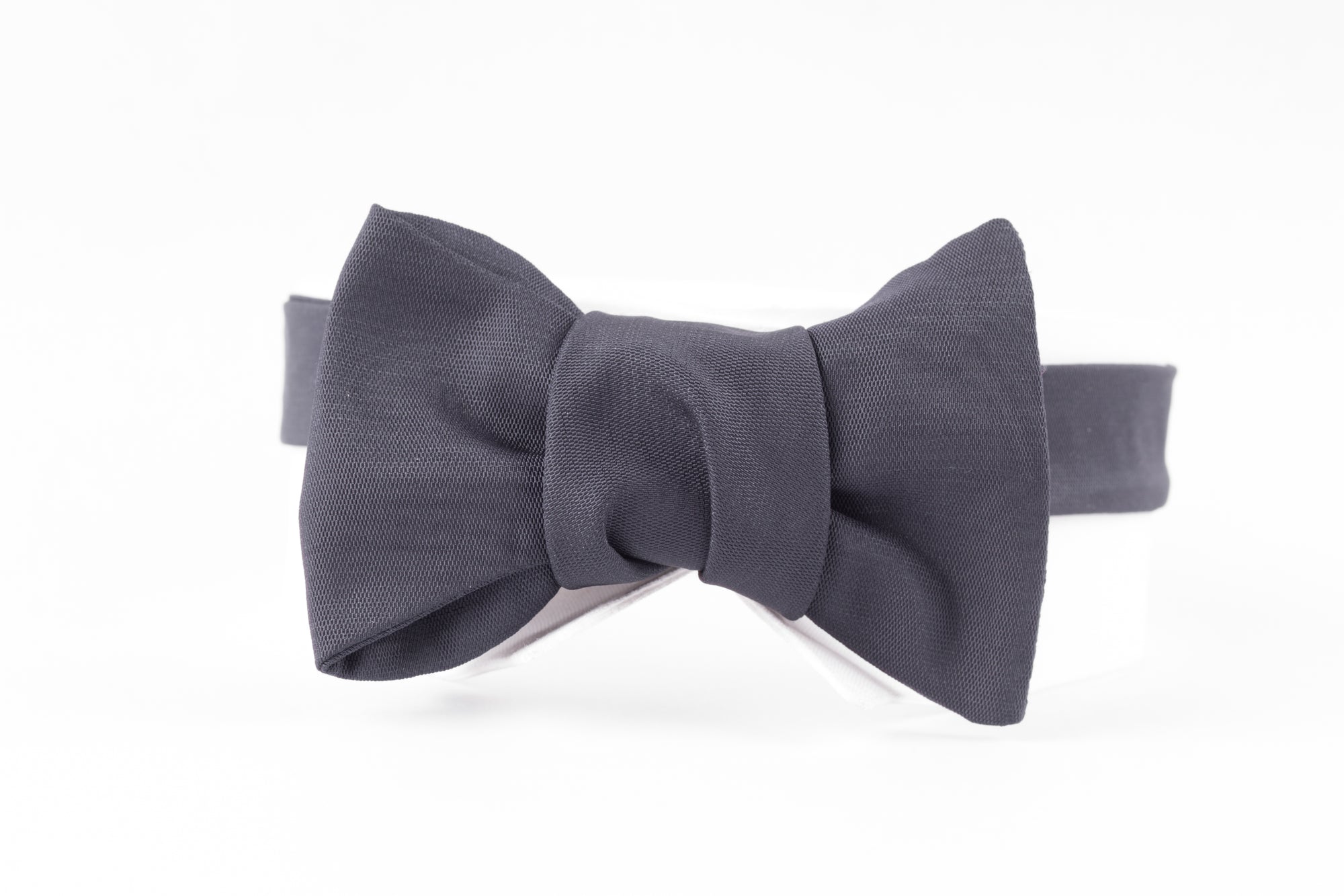 A Sovereign Grade Jumbo Barathea Butterfly Bow Tie from KirbyAllison.com on a white background, perfect for formal occasions.