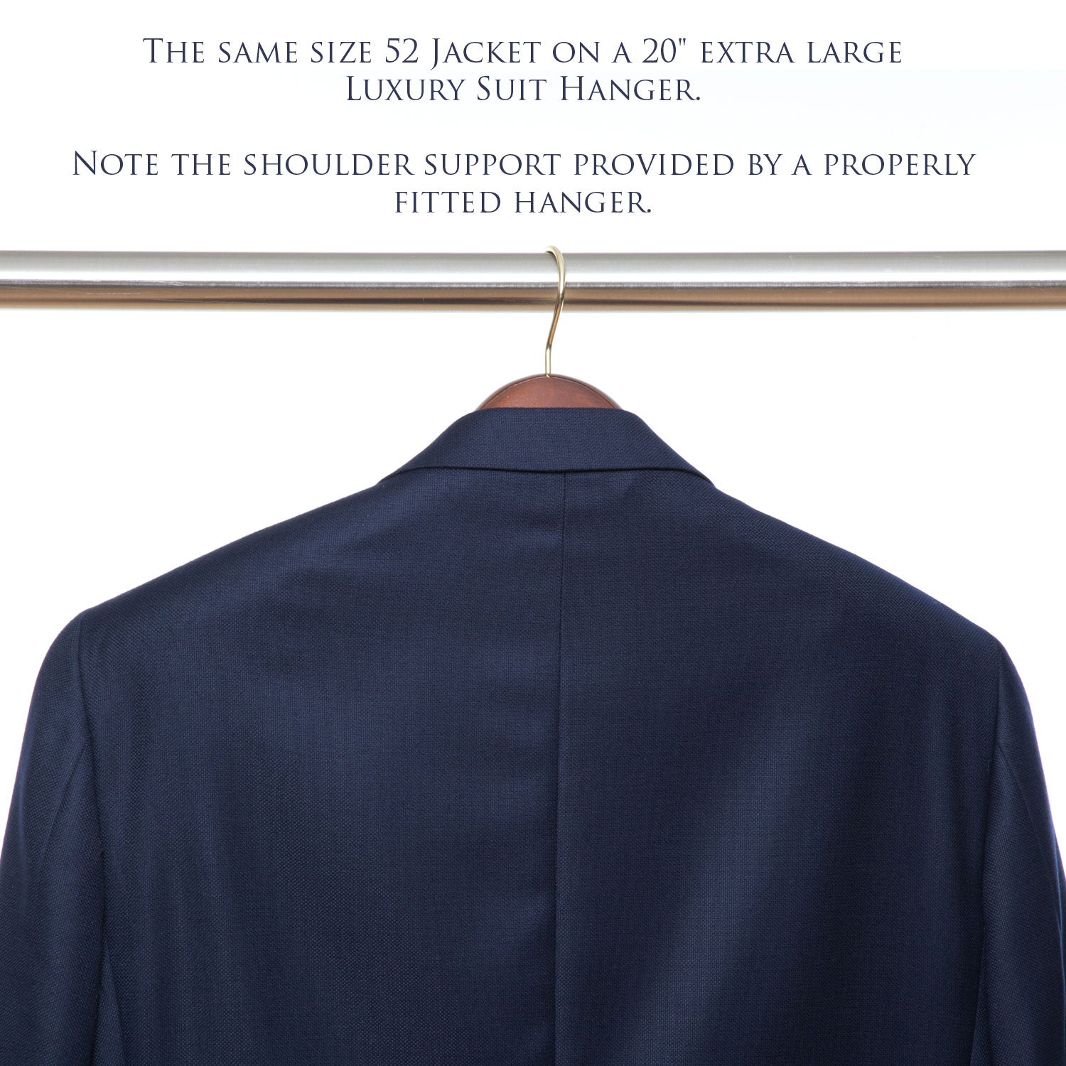 A KirbyAllison.com luxury wooden jacket hanger supports a tailor-made blue suit.
