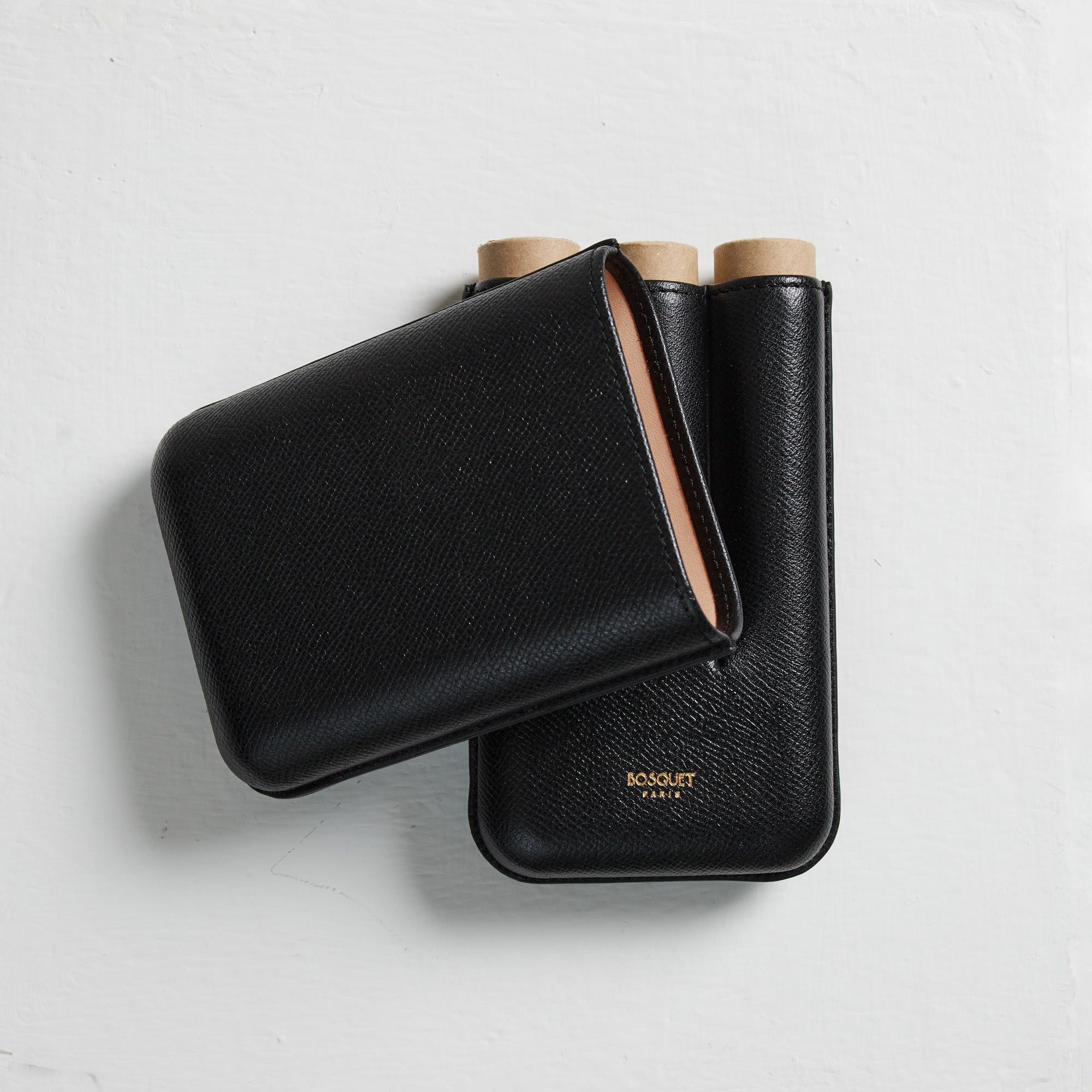 A Bosque Smooth Black Cylindrical Leather Cigar Case made with French leathers and a black cover.