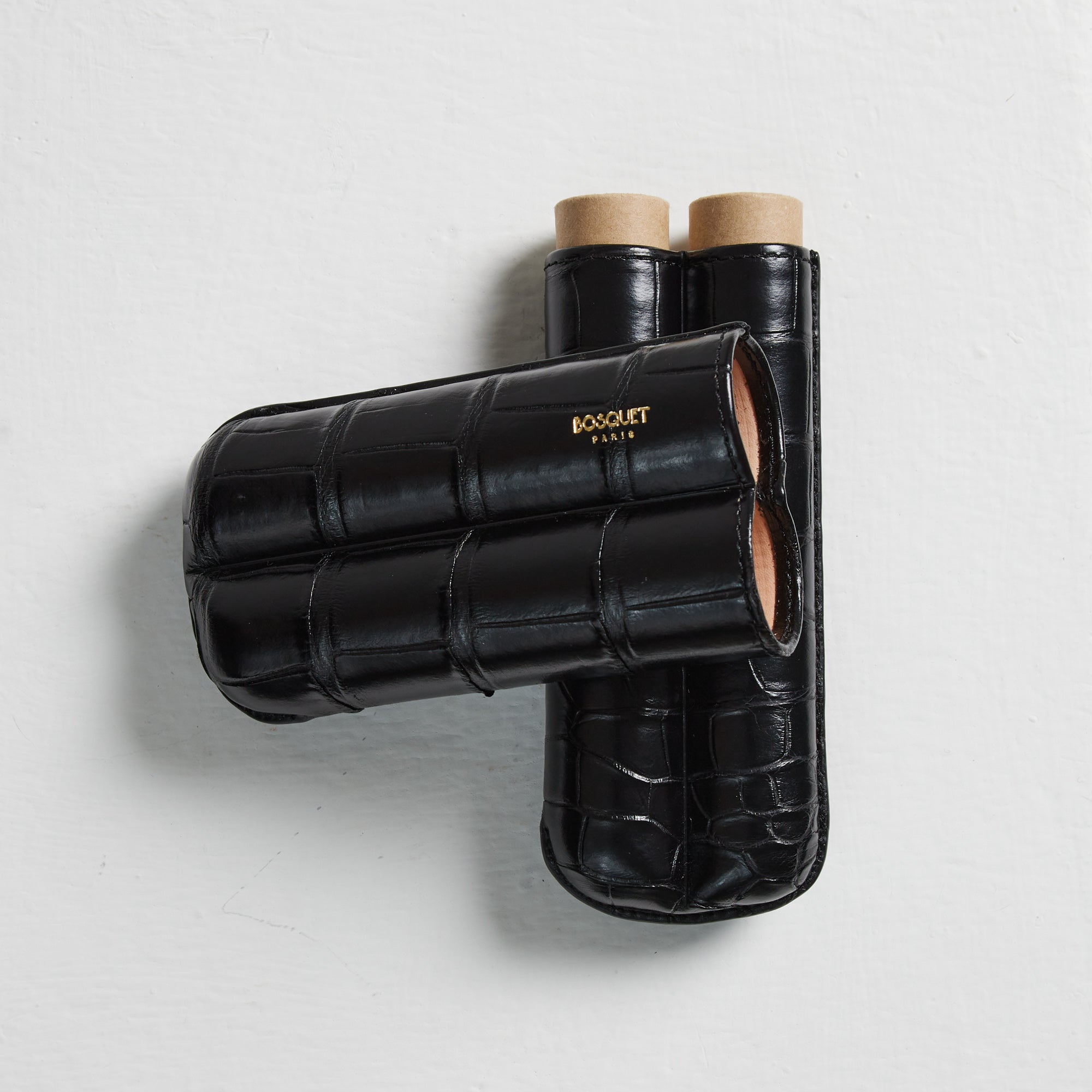 A black case with two tubes made of crocodile leather, designed for transportation of items such as Bosque Crocodile Cigar Cases.