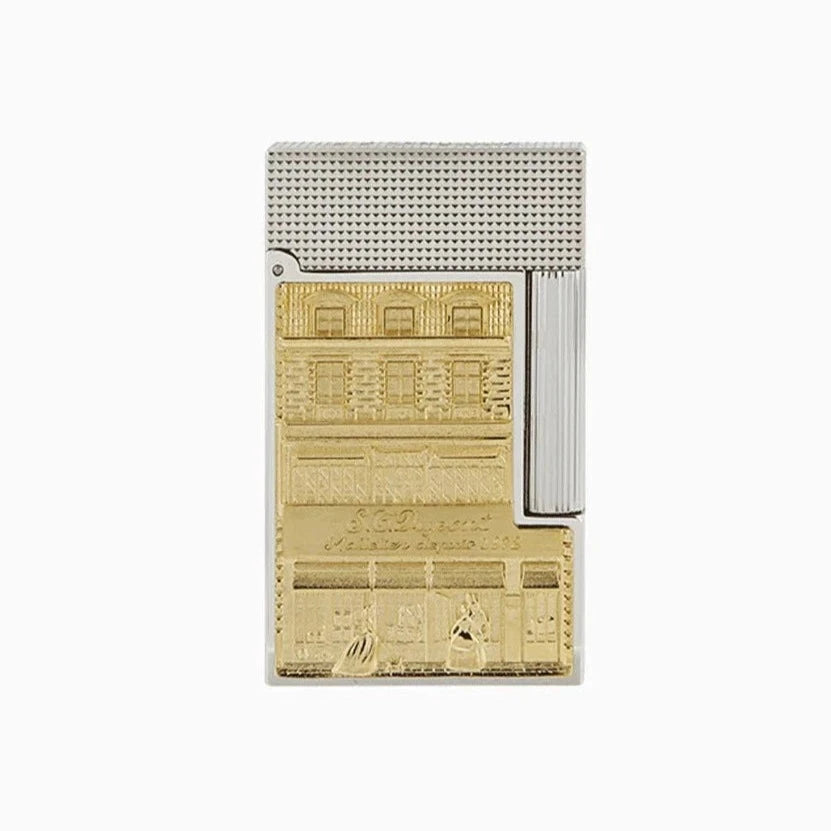 A S.T. Dupont Line 2 Hotel Particulier lighter with a gold plated design featuring a picture of a building.