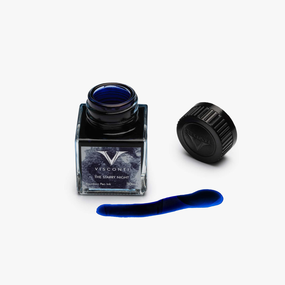 A Coles of London Visconti Van Gogh Starry Night Ink in Deep Blue inspired bottle of ink with a blue lid.
