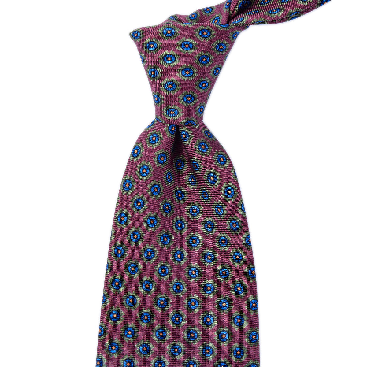 A Sovereign Grade Wine Deco Square Printed Silk Tie, handmade in the United Kingdom, with a blue and red pattern from KirbyAllison.com.