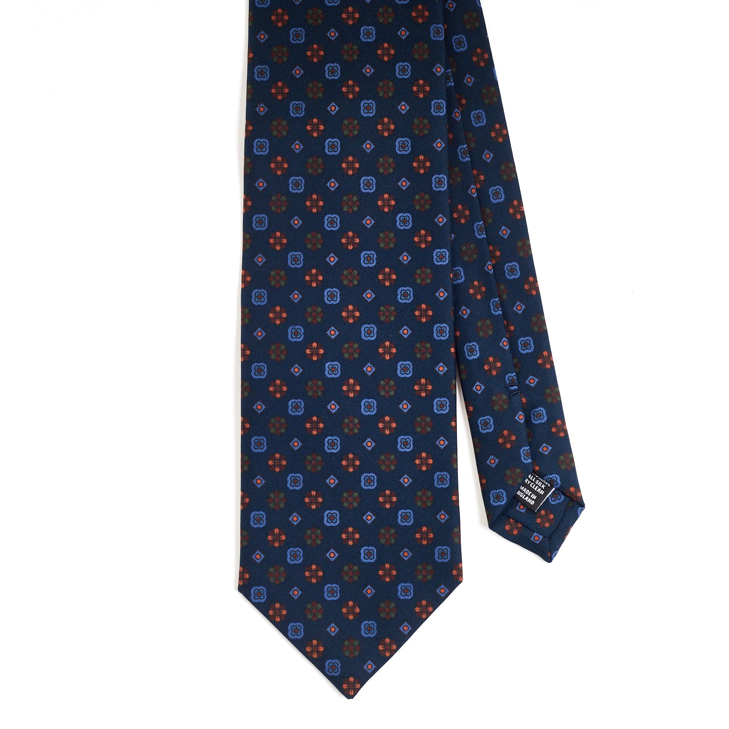 A KirbyAllison.com Sovereign Grade Dark Navy Mixed Floret Ancient Madder Tie with a blue and orange pattern of the highest quality.