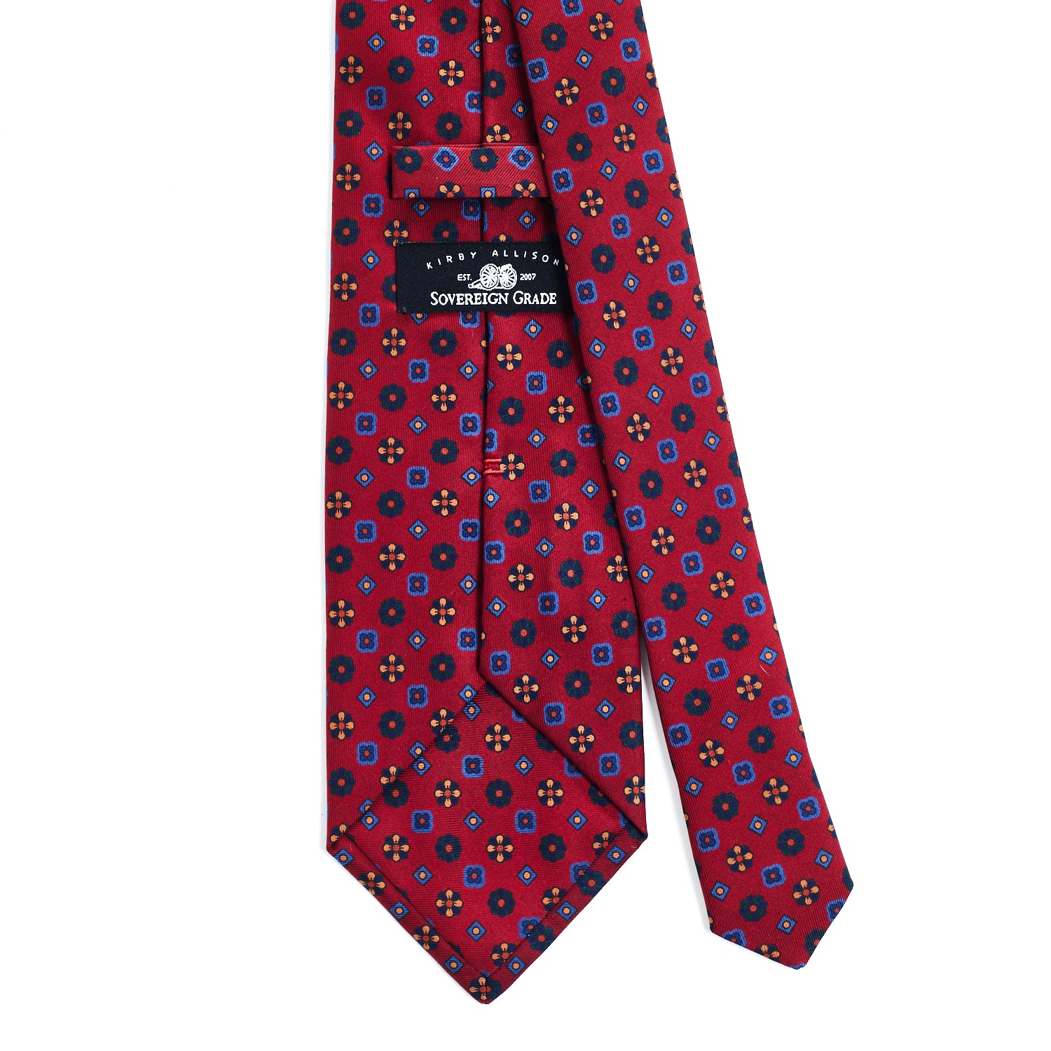 A high-quality Sovereign Grade Red Mixed Floret Ancient Madder Tie with a blue and red pattern by KirbyAllison.com.