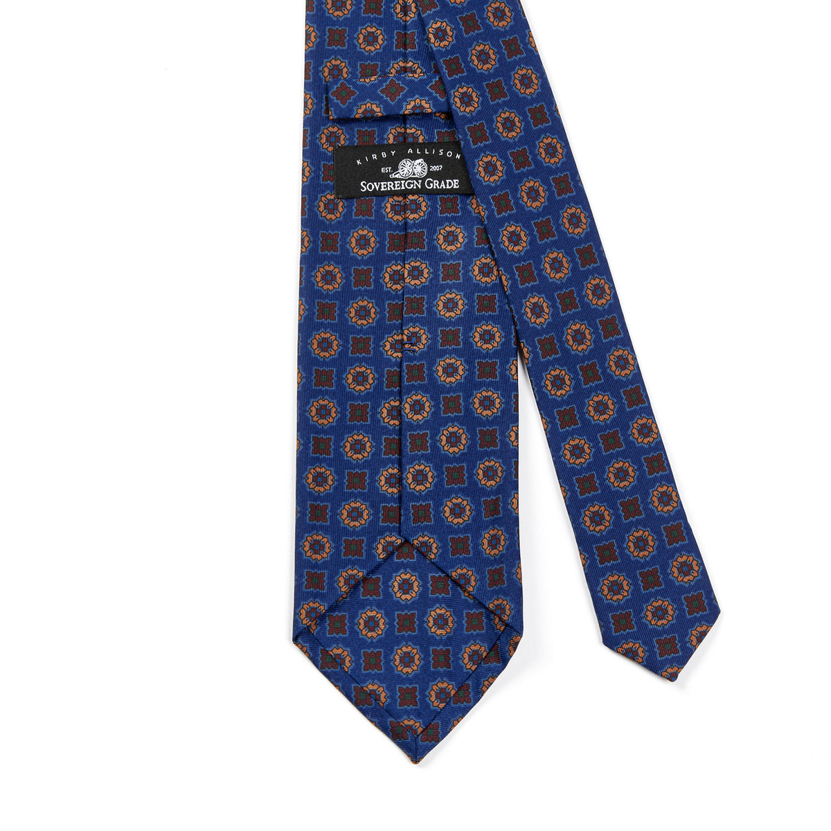 A high-quality, handmade Sovereign Grade Blue Floral Diamond Ancient Madder Tie by KirbyAllison.com, with a blue and brown pattern.