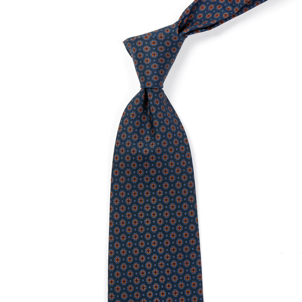 A Sovereign Grade Blue Small Floral Ancient Madder Tie from KirbyAllison.com, with a blue and orange pattern of the highest quality.