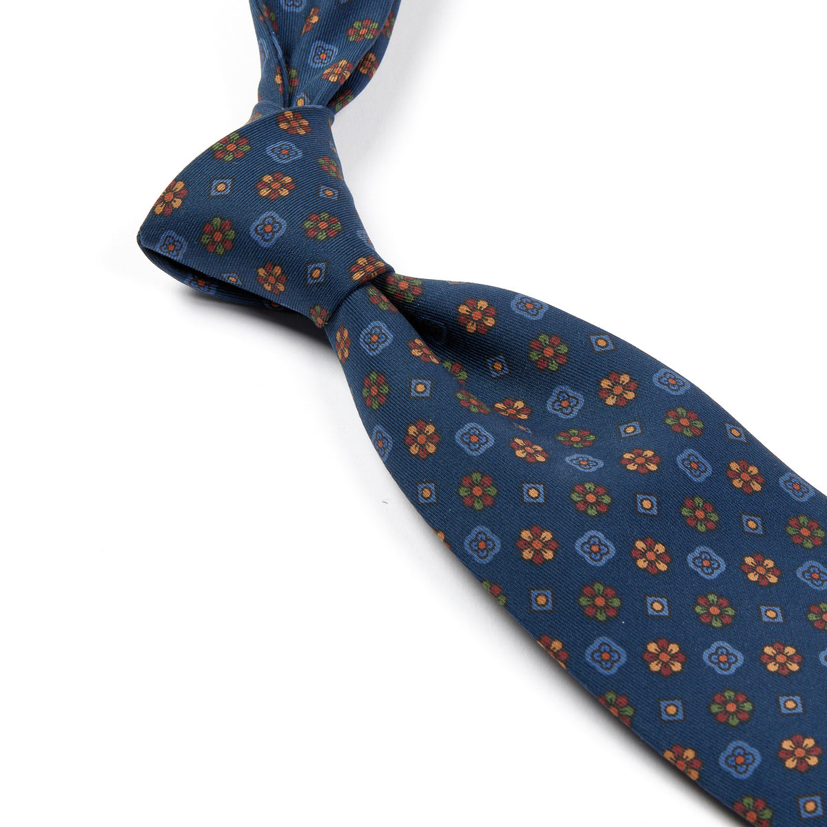 A high-quality, handmade Sovereign Grade Blue Mixed Floret Ancient Madder Tie with a brown and orange pattern from KirbyAllison.com.