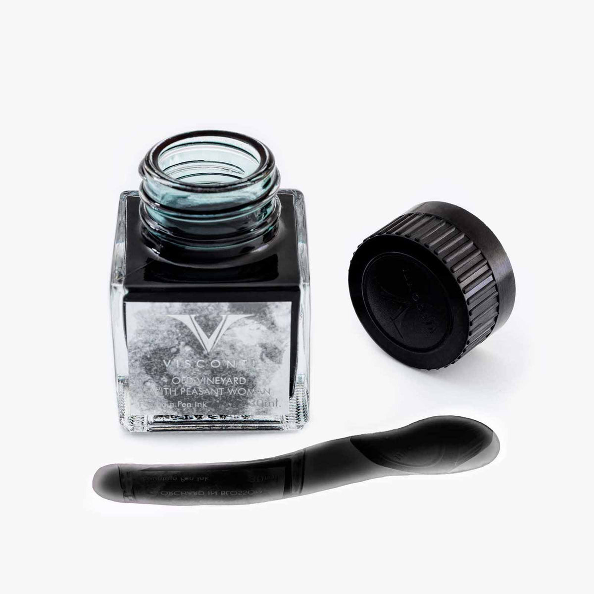 A bottle of Visconti Van Gogh Old Vineyard with Peasant Woman Ink in Grey with a brush next to it in the Coles of London Van Gogh Collection.