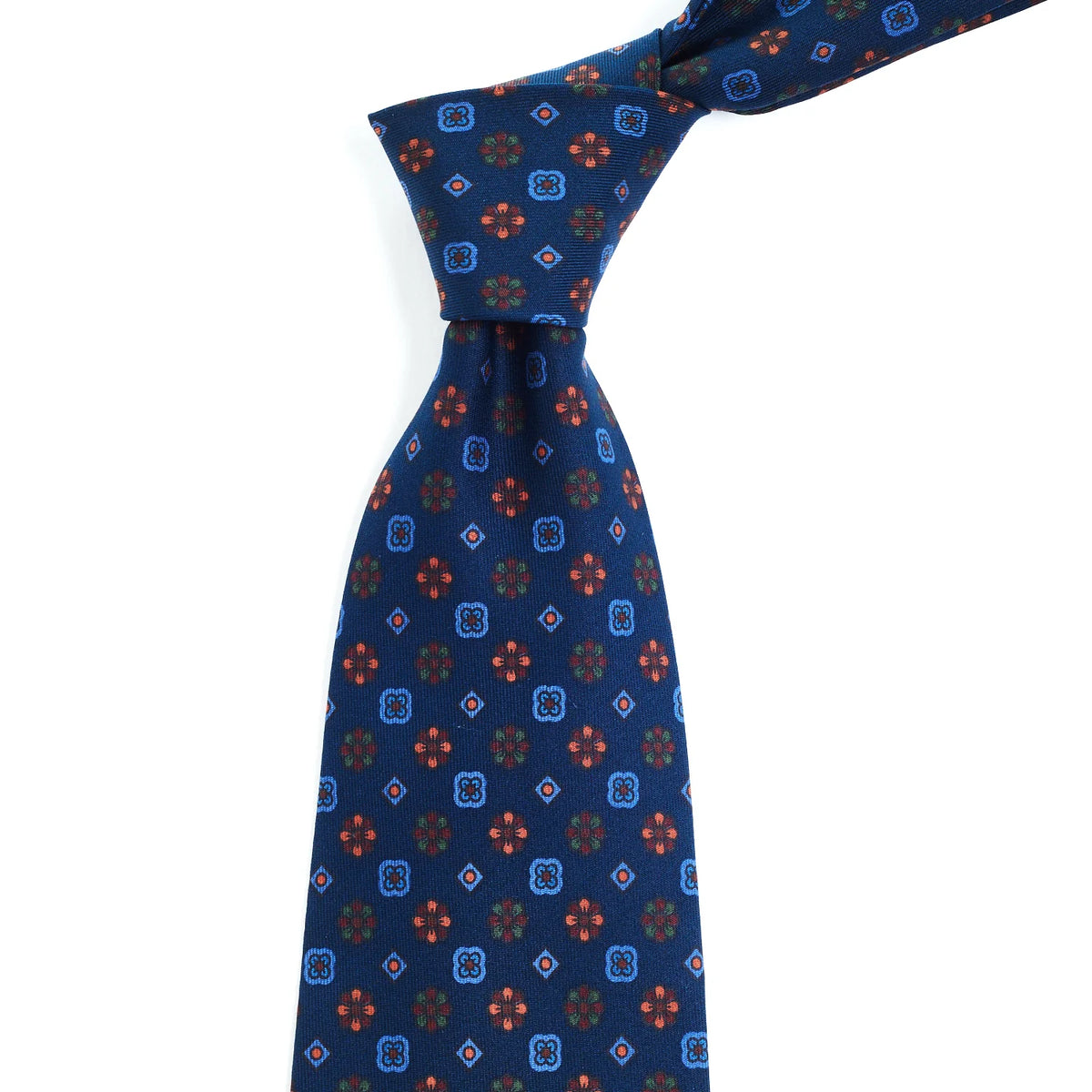 A high-quality Sovereign Grade Blue Mixed Floret Ancient Madder Tie with a handmade red and blue pattern from the United Kingdom, brought to you by KirbyAllison.com.