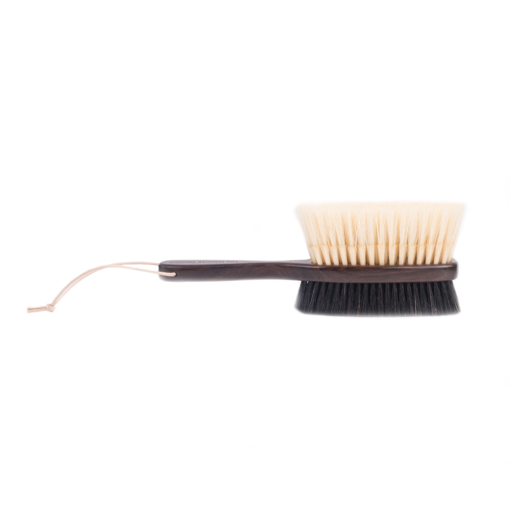 A KirbyAllison.com Ebony Deluxe Double-Sided Garment Brush on a white background, suitable for Wool and Cashmere garments.